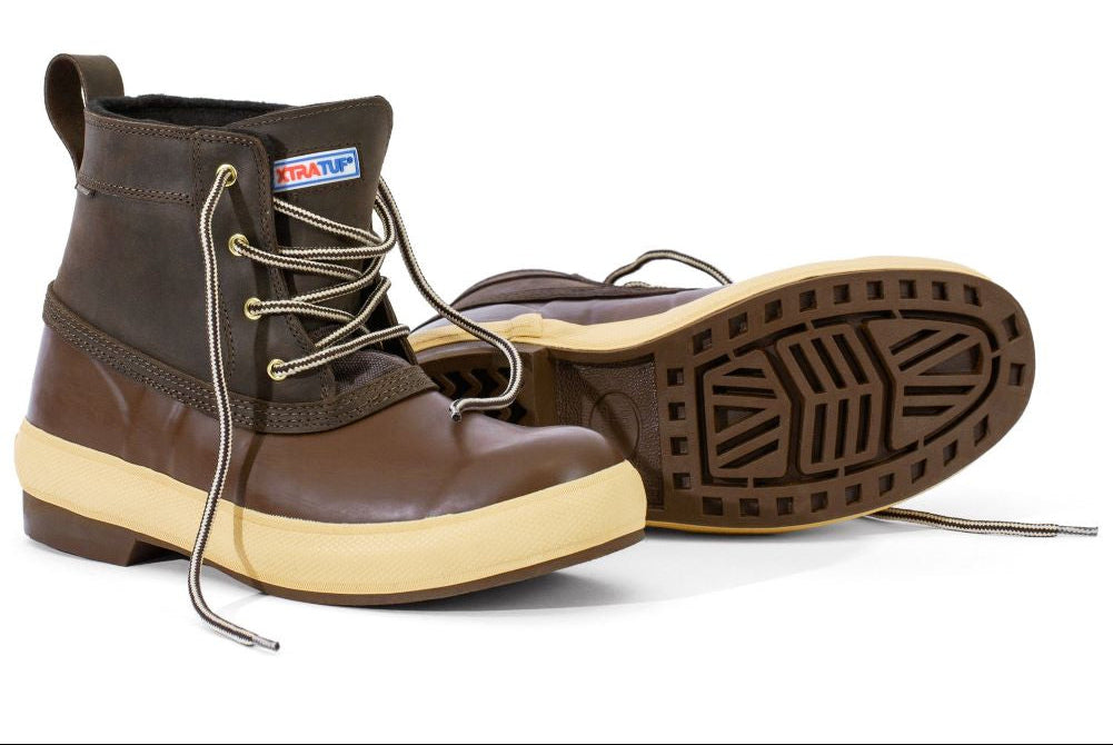 Brown rain boots with beige soles on a white background