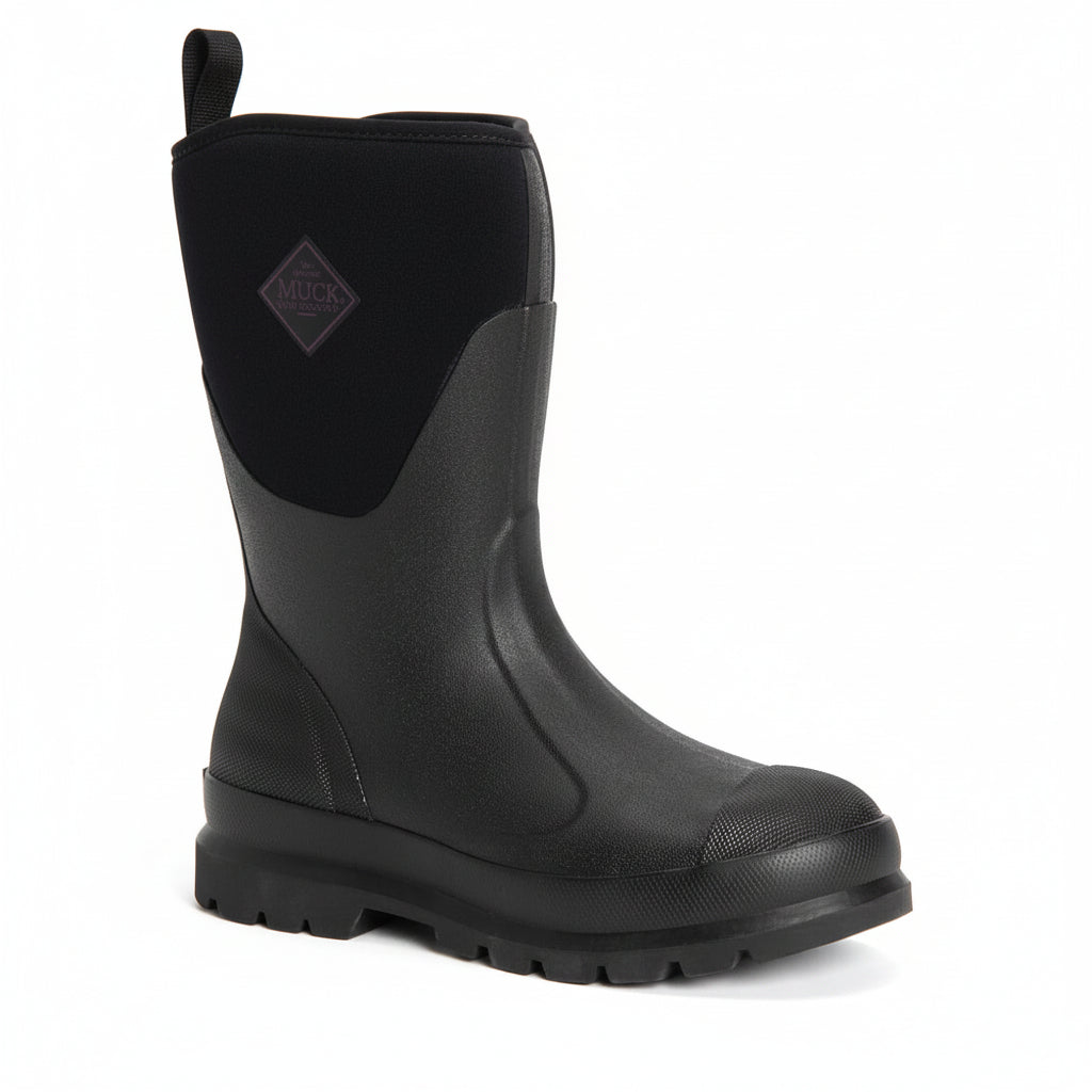 A single black mid-calf work boot with a textured rubber sole, a pull tab, and a black elastic gusset featuring a diamond-shaped 'MACK' logo patch, shown on a white background.